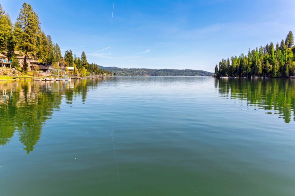 Waterfront homes with docks and beaches on Rockford Bay on the lake in the rural city of Coeur d'Alene, Idaho, USA.